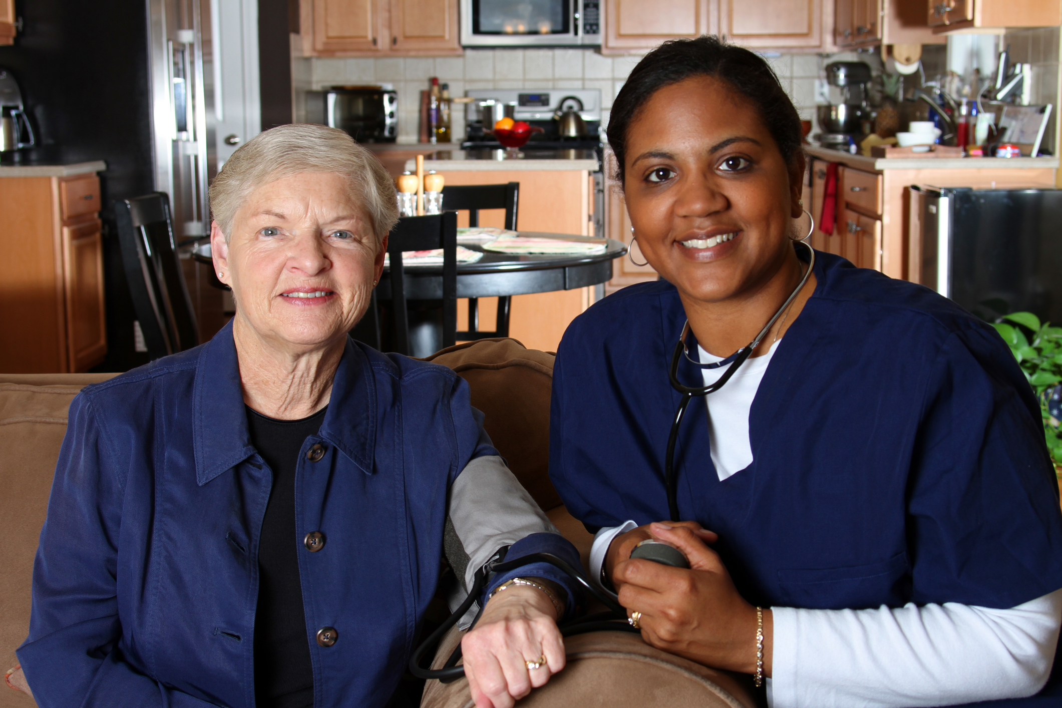 Home health care worker and an elderly woman